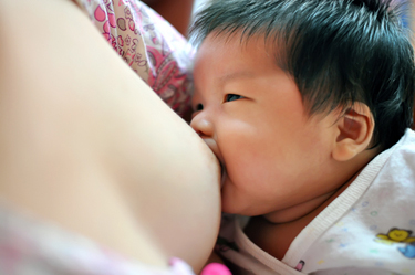Image of breast-feeding baby